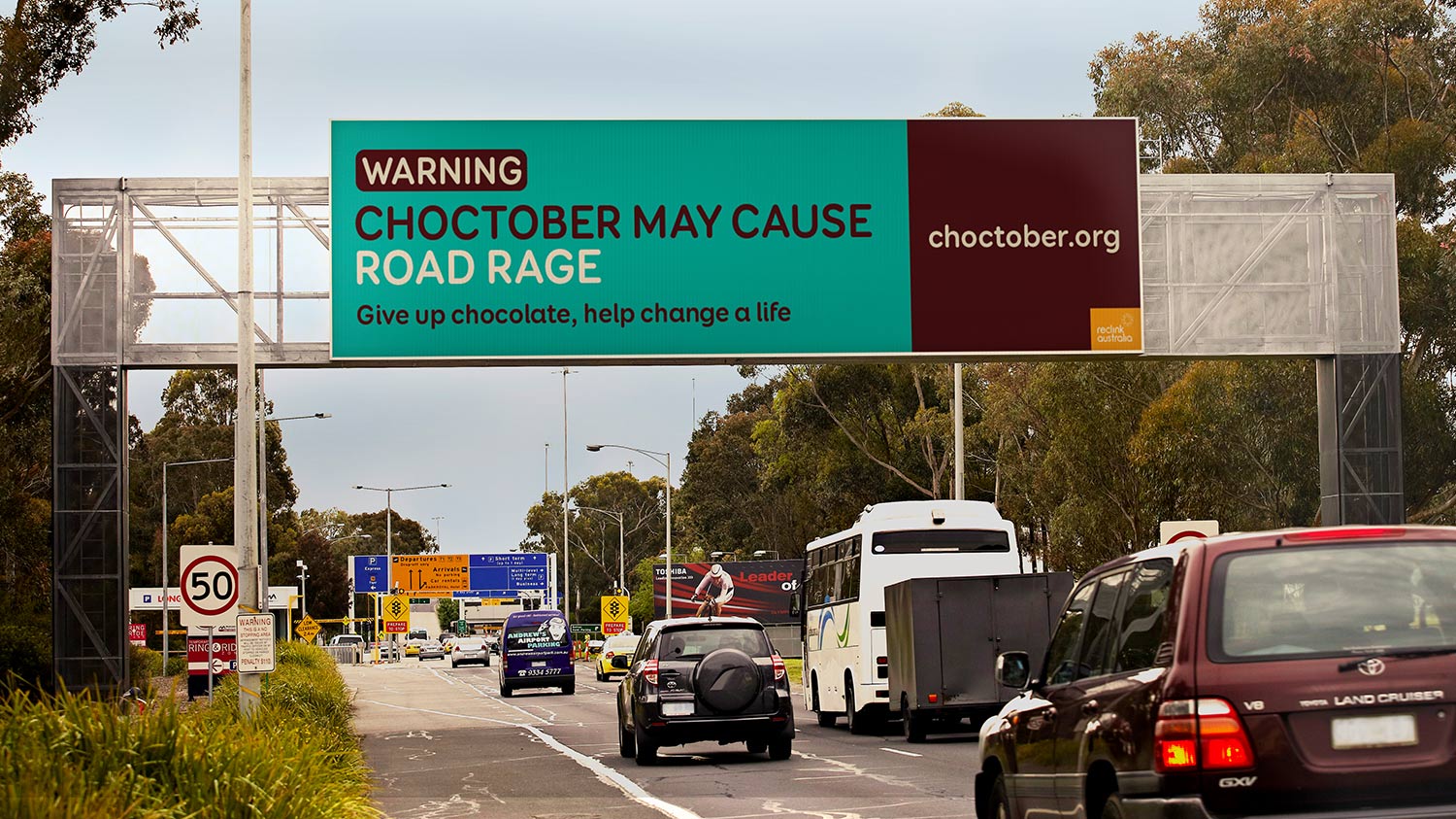 Choctober Billboard Outdoor Media | Warning. Choctober may cause road rage. Give up chocolate, help change a life