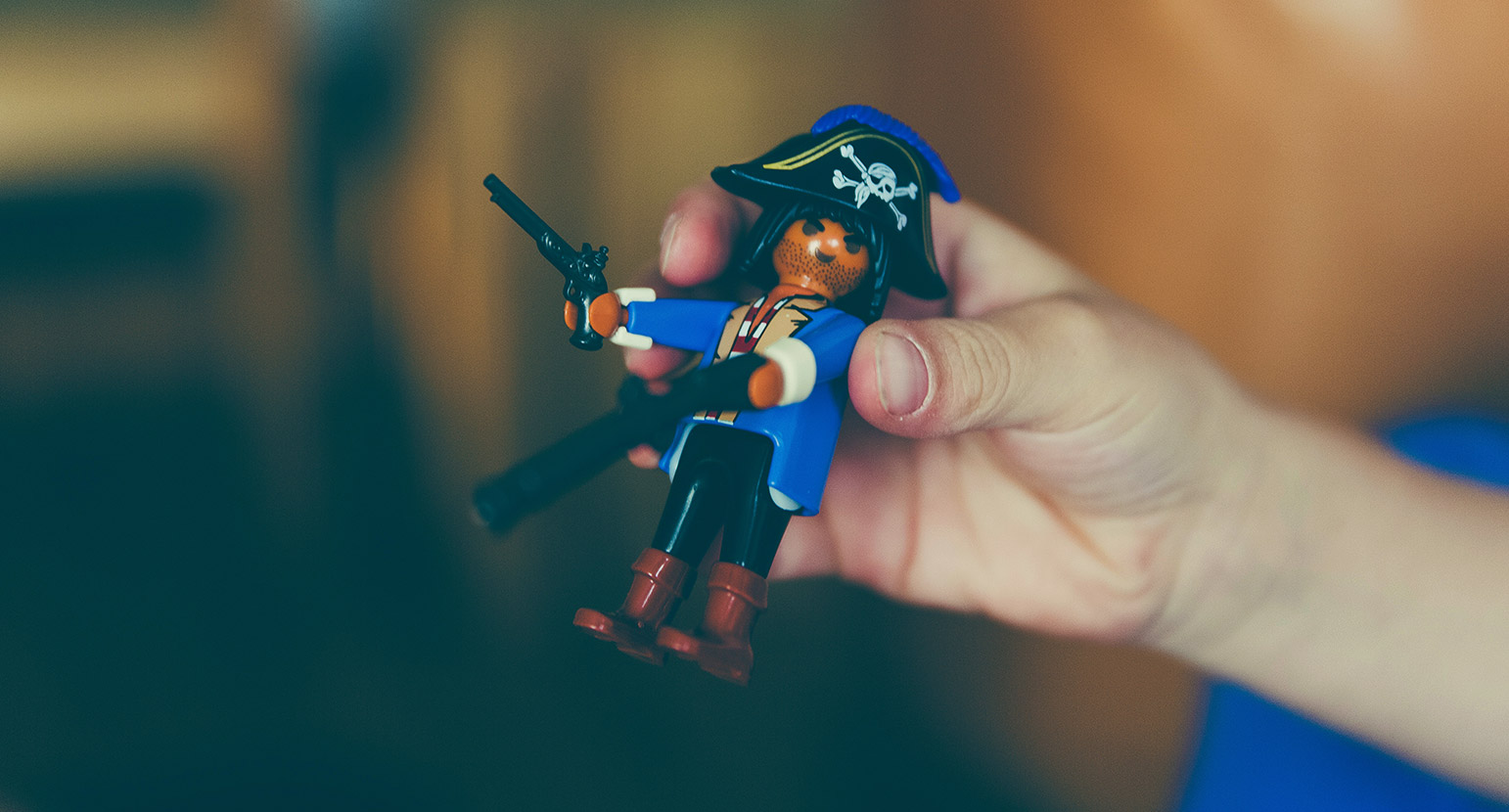 Man holds pirate Lego character