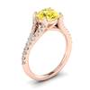 A solid 18k rose gold engagement ring with white created diamond accent stones.