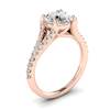 A spectacular 6mm round cut diamond centre stone handset in a solid 18k rose gold band.