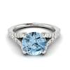 A white gold engagement ring with 6mm round cut natural aquamarine centre stone.