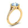 Solid 18k yellow gold engagement ring with pavé split shank set white created diamond accent stones.