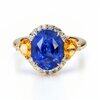Blue sapphire engagement ring with yellow sapphire side stones
