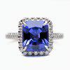 Octagon blue sapphire engagement ring with prong set accent stones