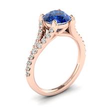This Ceylon sapphire engagement ring has features 26 created diamond accent stones in a pavé split shank setting.