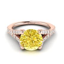 Yellow Ceylon sapphire engagement ring with pavé split shank set white created diamond accent stones.