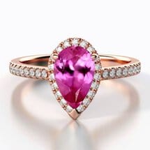 Brilliyond Jewellery pear-shaped pink sapphire halo engagement ring with diamond accents on white gold band.