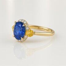 Blue sapphire engagement ring with yellow sapphire side stones