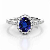 Blue sapphire oval halo engagement ring from Brilliyond
