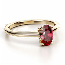 Yellow gold solitaire engagement ring with garnet