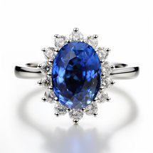 Blue Sapphire engagement ring reminiscent of the Princess Diana and Princess Kate's ring