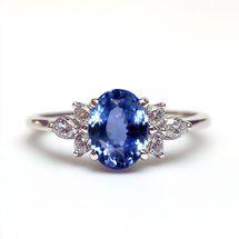 blue sapphire multi stone engagement ring with prominent centre stone