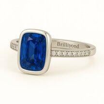 Brilliyond Jewellery white gold ring with rectangular blue sapphire center, cushion cut, and diamond accents.