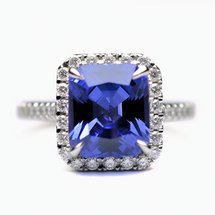 Octagon blue sapphire engagement ring with prong set accent stones