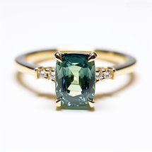 Green sapphire  engagement ring with slim yellow gold band