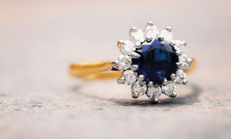 helo sapphire engagement ring in yellow gold