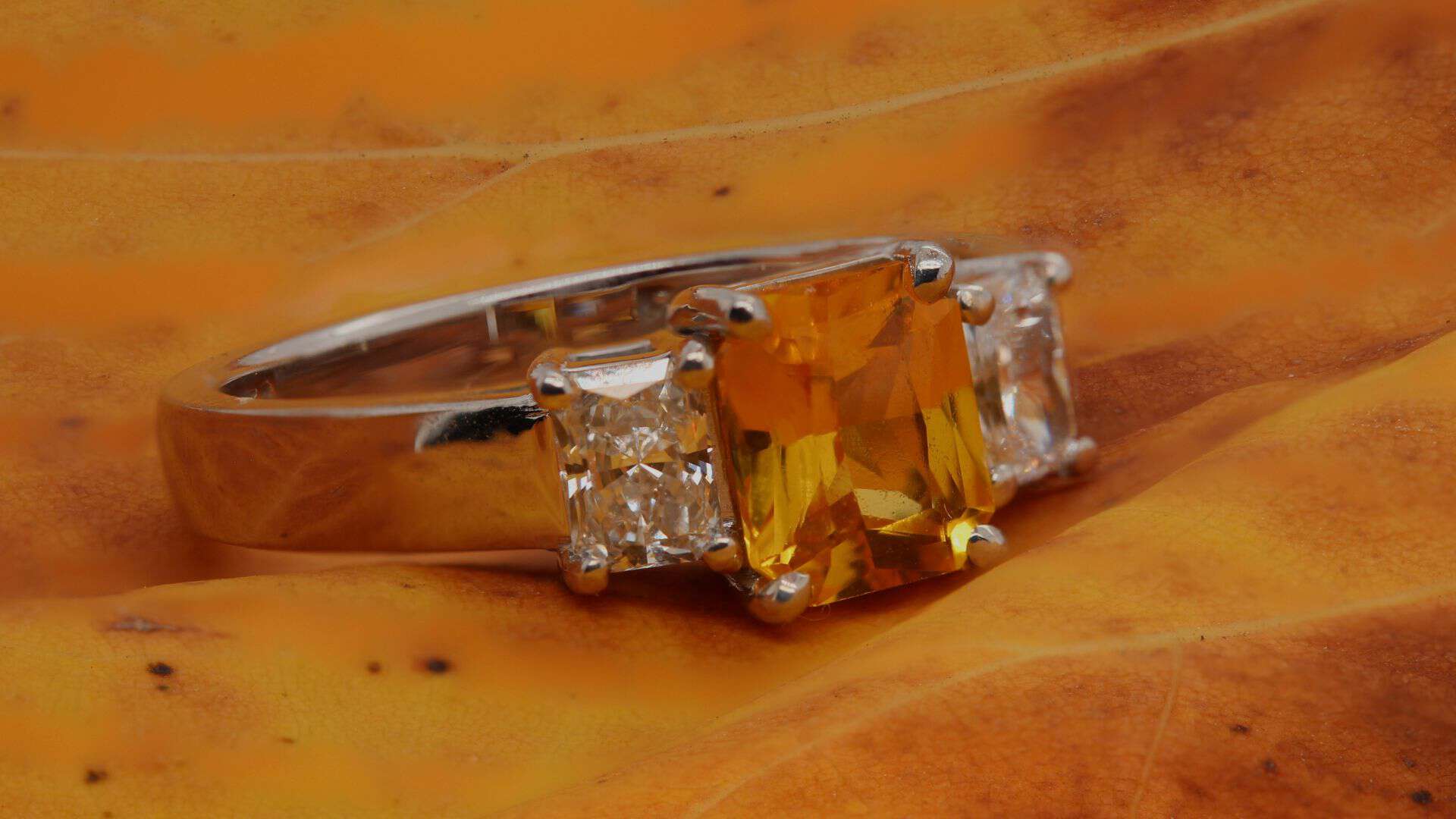 Yellow sapphire engagement ring with side diamonds