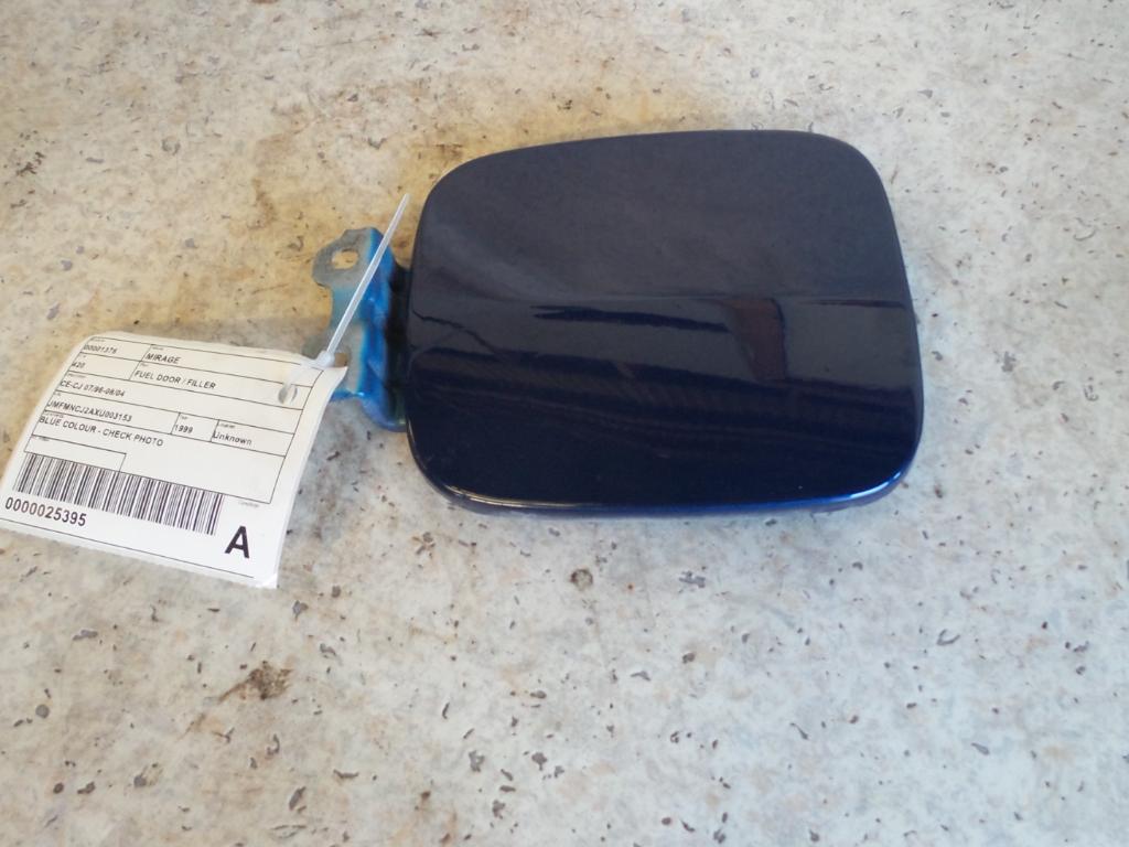 1999 Mitsubishi Mirage Fuel Door / Filler View Auto part Fuel Door / Filler Mitsubishi Mirage 1999