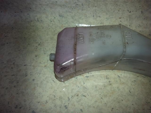 View Auto part Overflow Bottle Subaru Forester 2001
