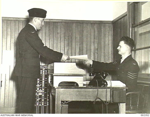 RAAF TRAINING. THE TRAINEE RECEIVES HIS WINGS AND IS NOW A FULLY ...
