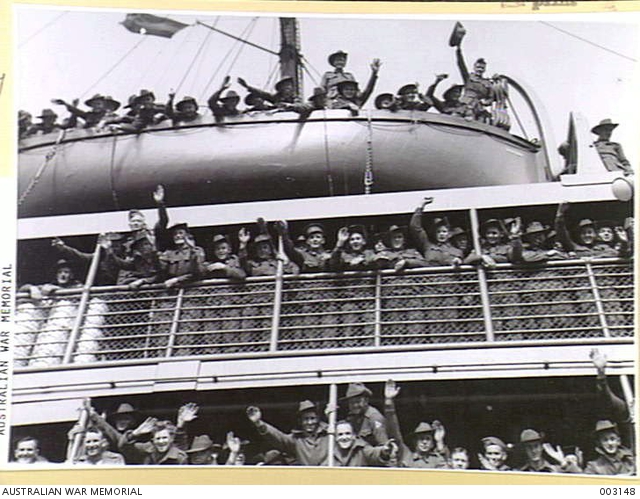 Troops line the rails while others take advantage of good positions to ...