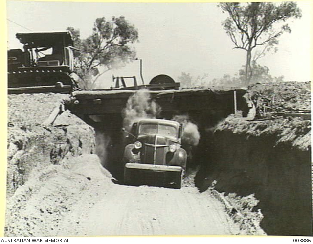 CENTRAL AUSTRALIA - NEAR BIRDUM - LOADING TRUCK WITH GRAVEL BY TRACTOR ...