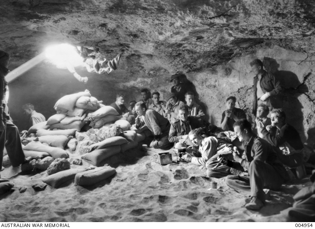 BEFORE BARDIA - AT THE ARTILLERY POSITION: GUNNERS OFF DUTY REST IN THE ...