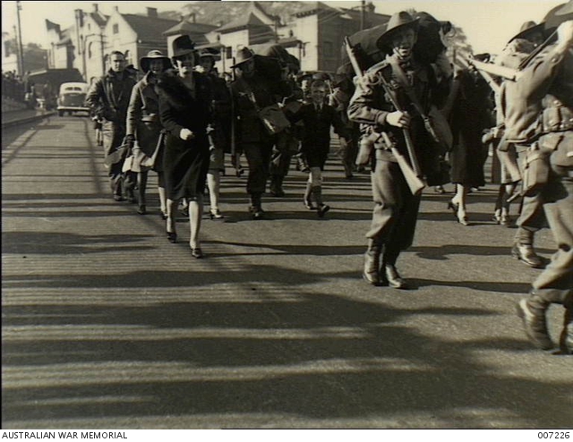 Sydney, NSW. Women and children march along the streets with soldiers ...