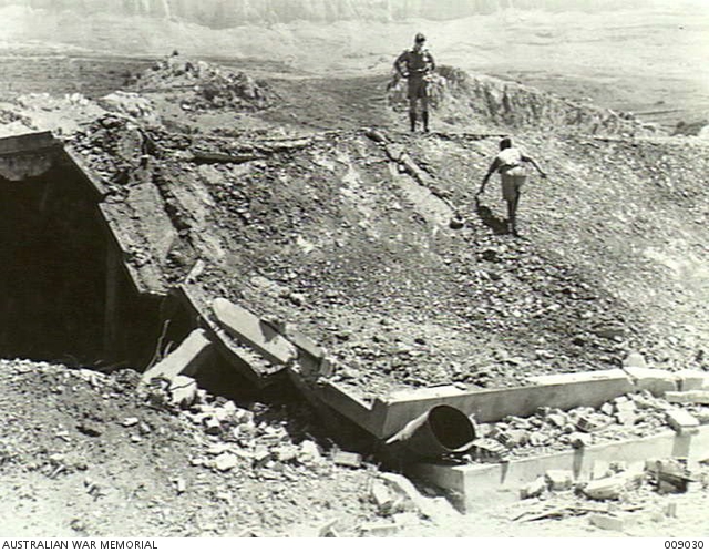 SYRIA. R.A.F. BOMB AMMUNITION DUMP., EVERY SHED WAS DAMAGED SOME WAY OR ...