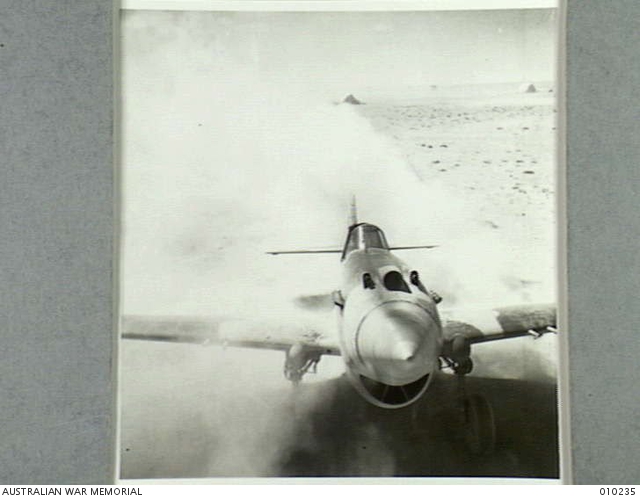 WESTERN DESERT. TOMAHAWK IN FLIGHT. ONE OF THE PILOTS OF THIS SQUADRON ...