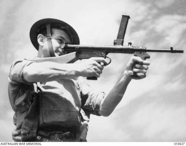 THE OWEN GUN CAN BE FIRED EITHER FROM THE SHOULDER OR HIP Australian 