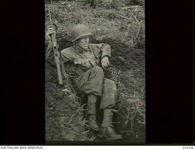 New Britain. Major H. E. Rose of Victoria, Texas, trys out his slit ...