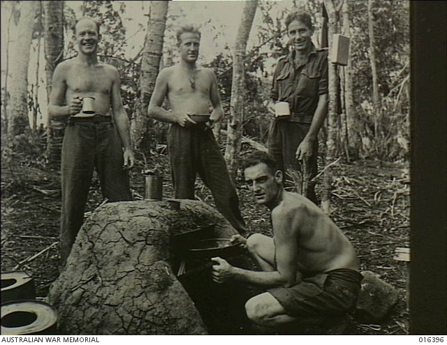 New Guinea. The Army cook is always a favourite among the lads ...