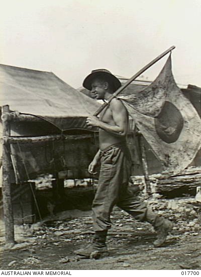 New Guinea. This Japanese flag was captured by Leading