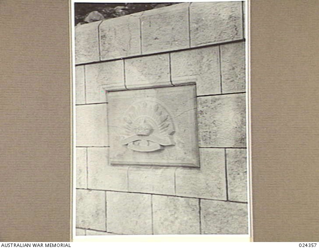 TRIPOLI, SYRIA. 1942-06-09. RISING SUN EMBLEM ON STONE PLAQUE SET IN ...