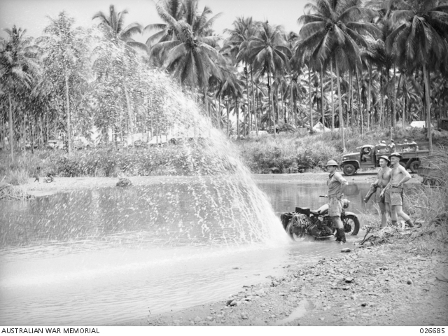 MILNE BAY, PAPUA. 1942-10. AN AUSTRALIAN DESPATCH RIDER WHOSE MOTOR ...