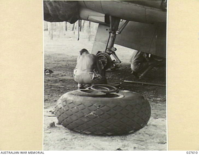 BATCHELOR, N.T. 1942-10-28. A MECHANIC OF NO. 2 SQUADRON RAAF REPAIRING ...
