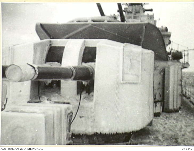 OFF WEST COAST OF KOREA, 1951-01. HEAVY ICE ON A TURRET OF HMAS 