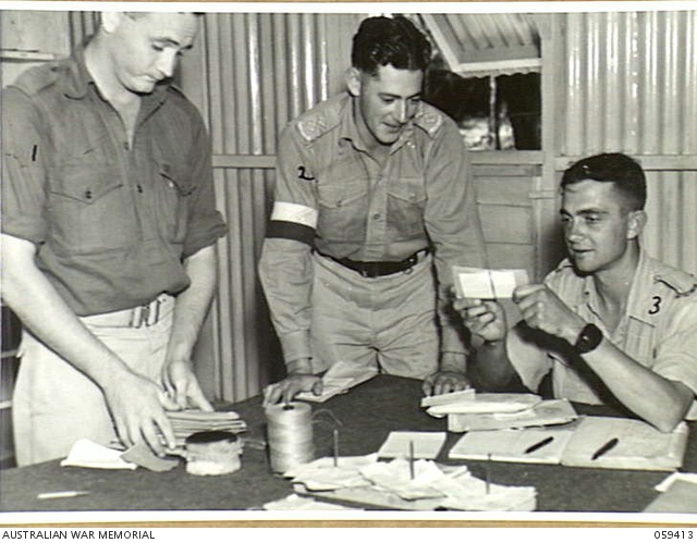 BARRINE, QLD. 1943-11-02. SORTING IN THE DESPATCH RIDER LETTER SERVICE ...