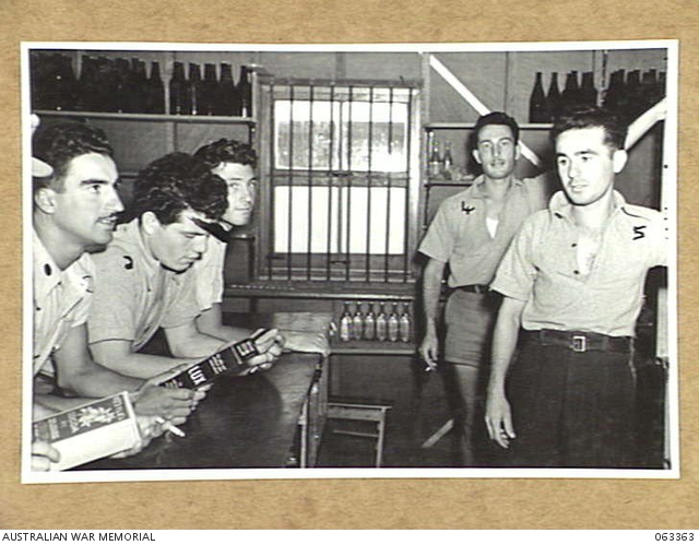 HAY, NSW. 1944-01-16. ITALIAN PRISONERS OF WAR PURCHASING GOODS AT THE ...