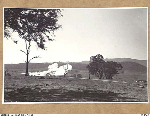 BATHURST, NSW. 1944-04-19. SMOKE BOMBS EXPLODING ON THE MORTAR TARGET ...