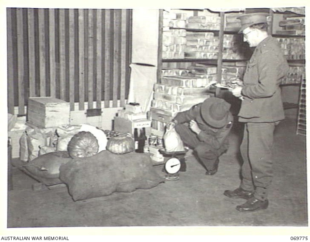 SYDNEY, NEW SOUTH WALES, AUSTRALIA. 1943-08-08. WEIGHING OUT ITEMS OF ...