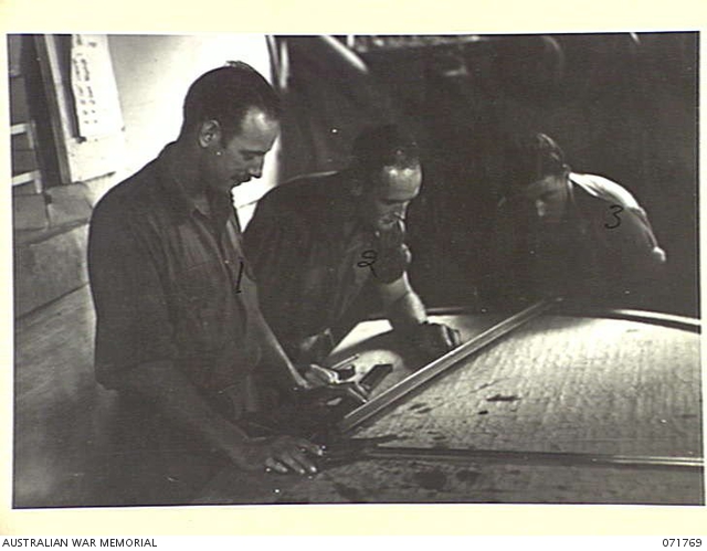 LAE, NEW GUINEA, 1944-03-29. THREE OF THE TEN MEN WHO MAN THE BATTERY ...
