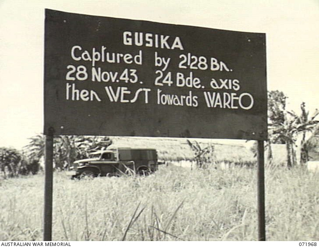 GUSIKA, NEW GUINEA. 1944-03-31. ONE OF MANY BATTLE SIGNS MARKING ...
