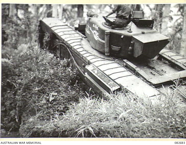 MADANG, NEW GUINEA. 1944-10-12. A CHURCHILL V TANK BOGGED AT A CREEK ...