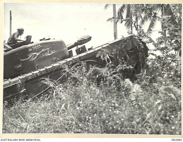 MADANG, NEW GUINEA. 1944-10-12. A CHURCHILL V TANK BOGGED AT A CREEK ...