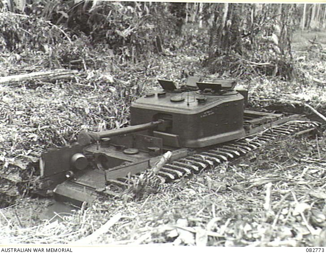 MADANG, NEW GUINEA. 1944-10. A CHURCHILL VII TANK BOGGED DOWN DURING ...