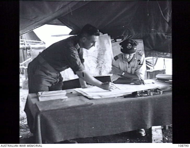 MOROTAI, 1945-06-06. FLIGHT OFFICER J. HOBBS (1) AND FLIGHT LIEUTENANT ...