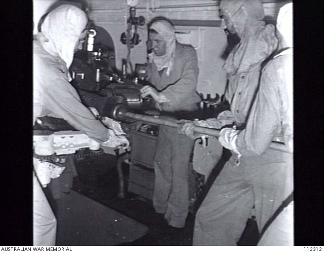 AT SEA. 1945-06-18. PETTY OFFICER ROCHE AND MEMBERS OF HIS GUN CREW ...