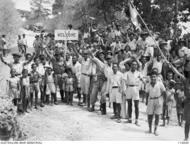 SOE, TIMOR. 1945-09-17. LOCAL INHABITANTS WELCOMING MEMBERS OF TIMFORCE ...